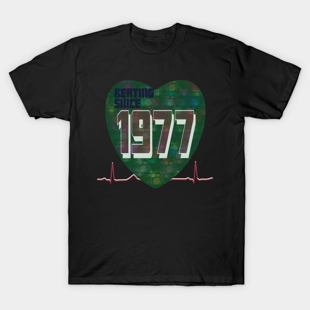 1977 - Beating Since (heart with green drum Kit overlay) T-Shirt by KateVanFloof